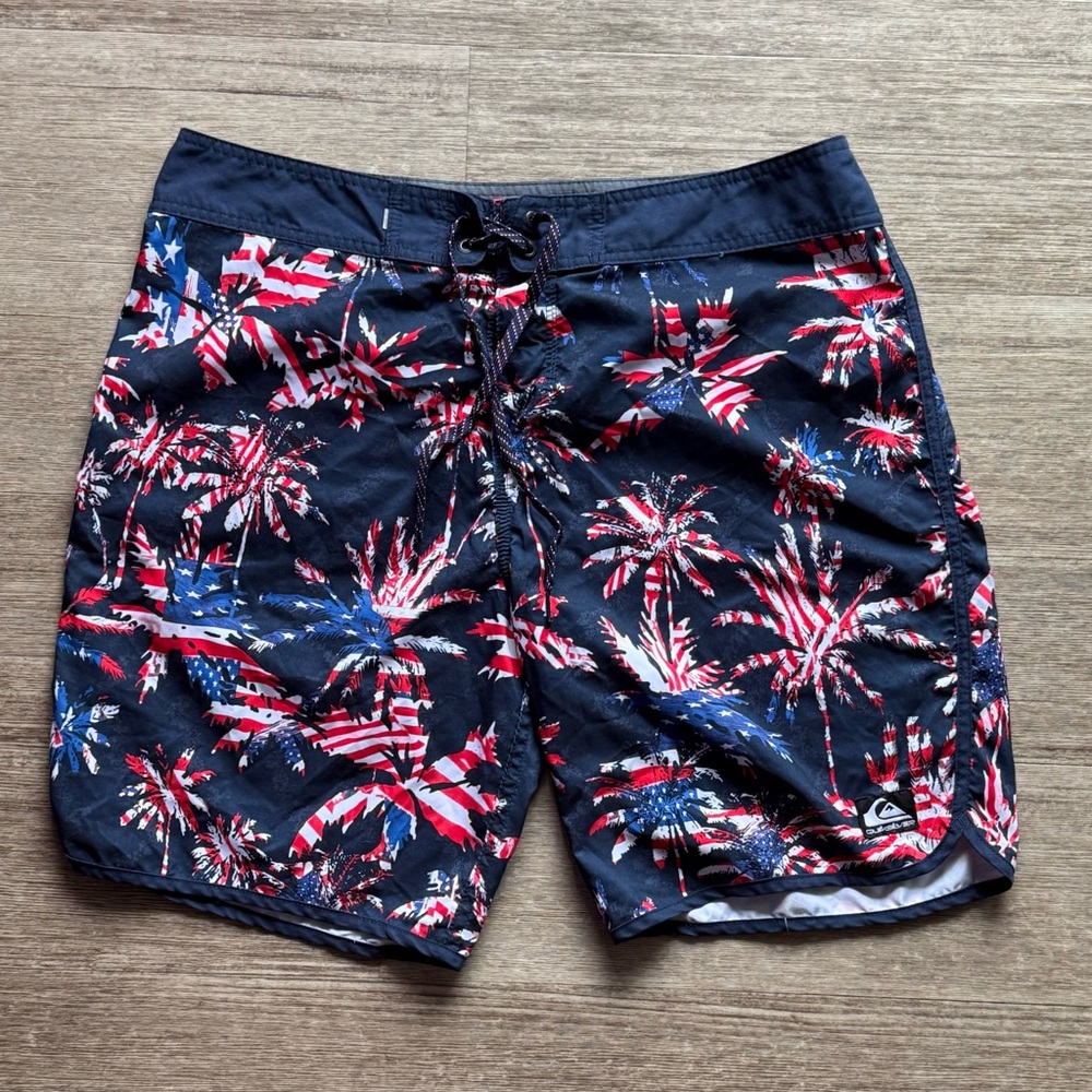 Quiksilver Blue and Red Board Shorts with Festive Fireworks Design